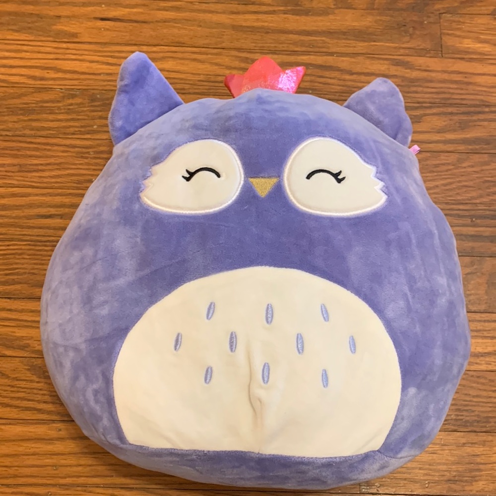 A very cute purple owl with a pink mini crown